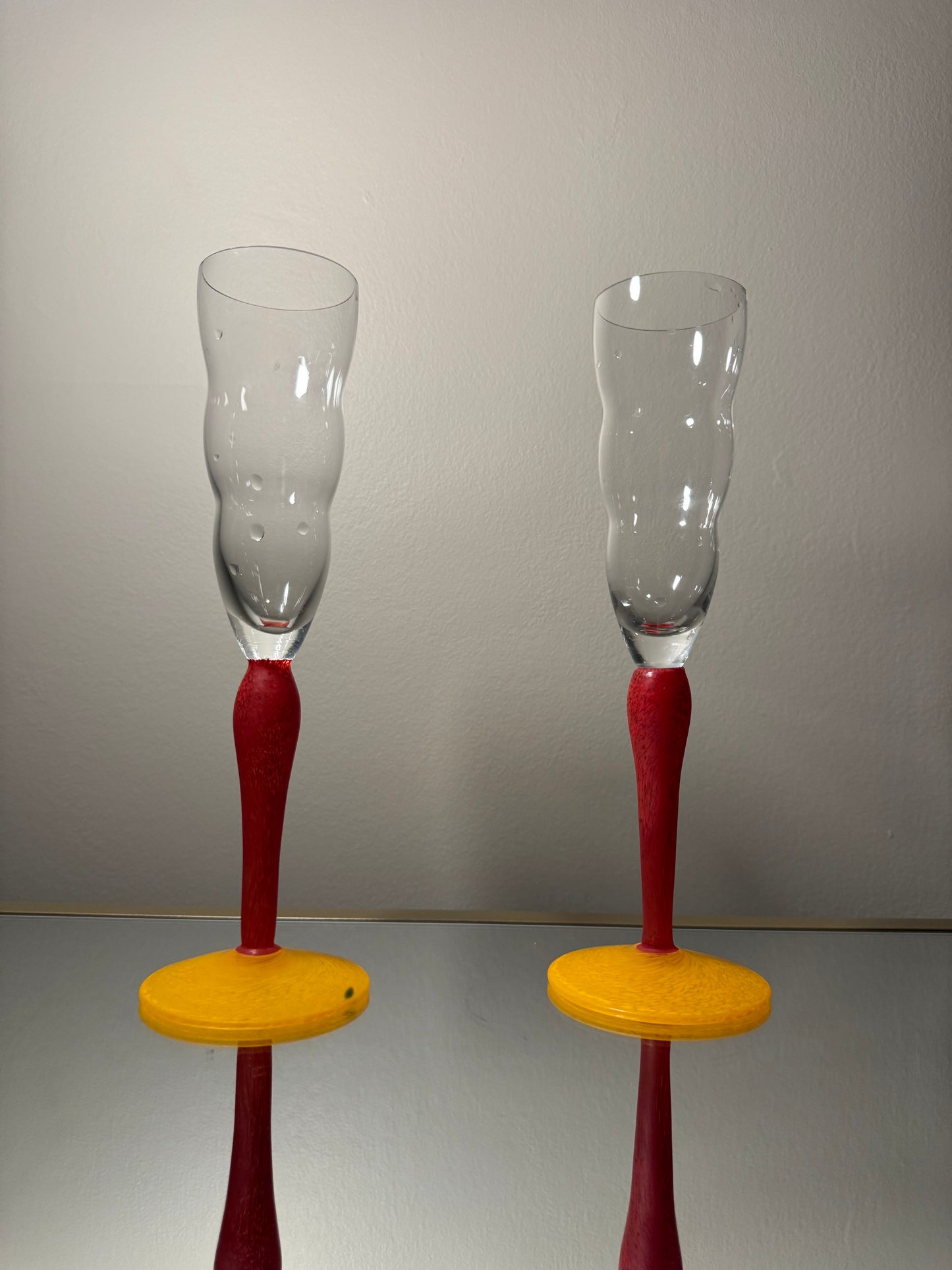 clear wavy glasses w/ red & yellow stem
