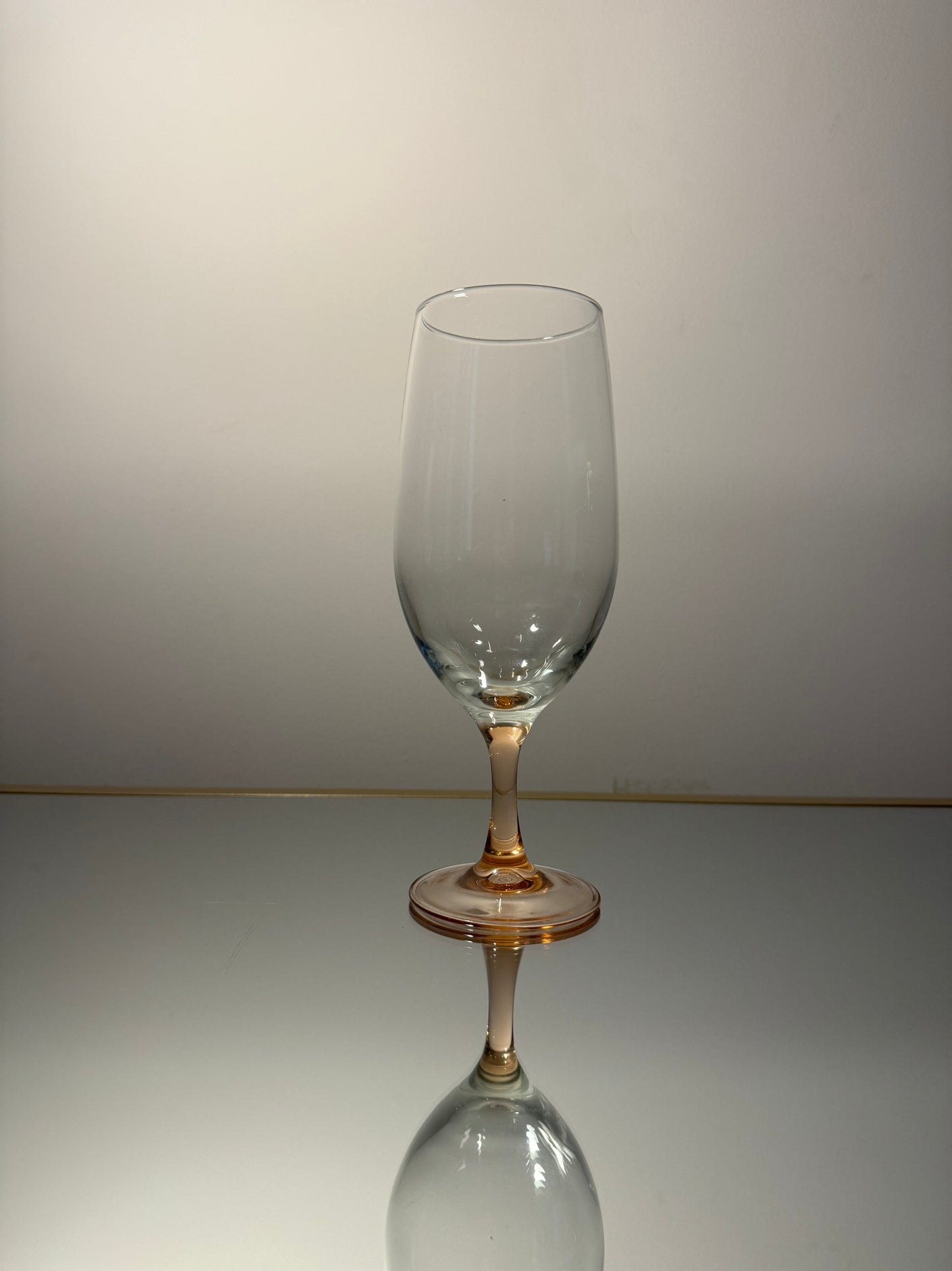 clear wine glass w/ peach stem