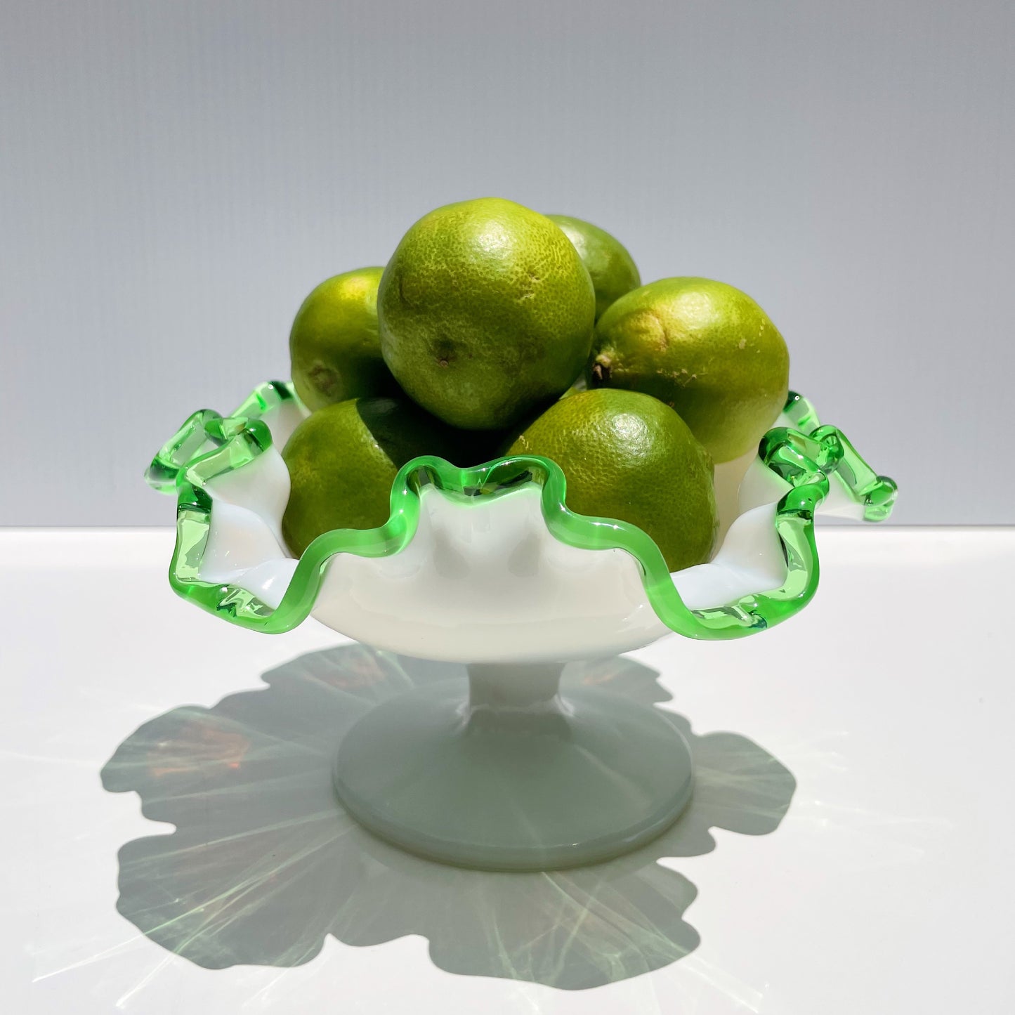 milk glass dish w/ green rim