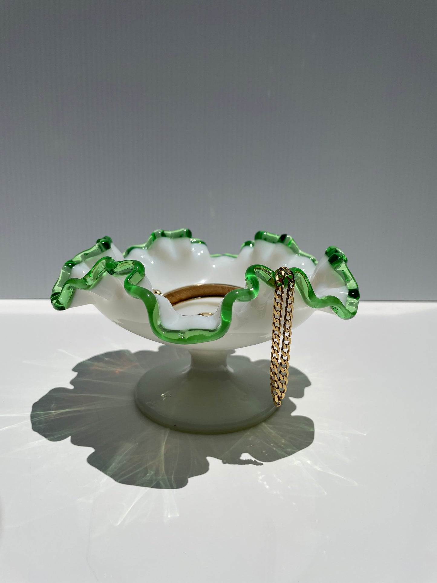 milk glass dish w/ green rim
