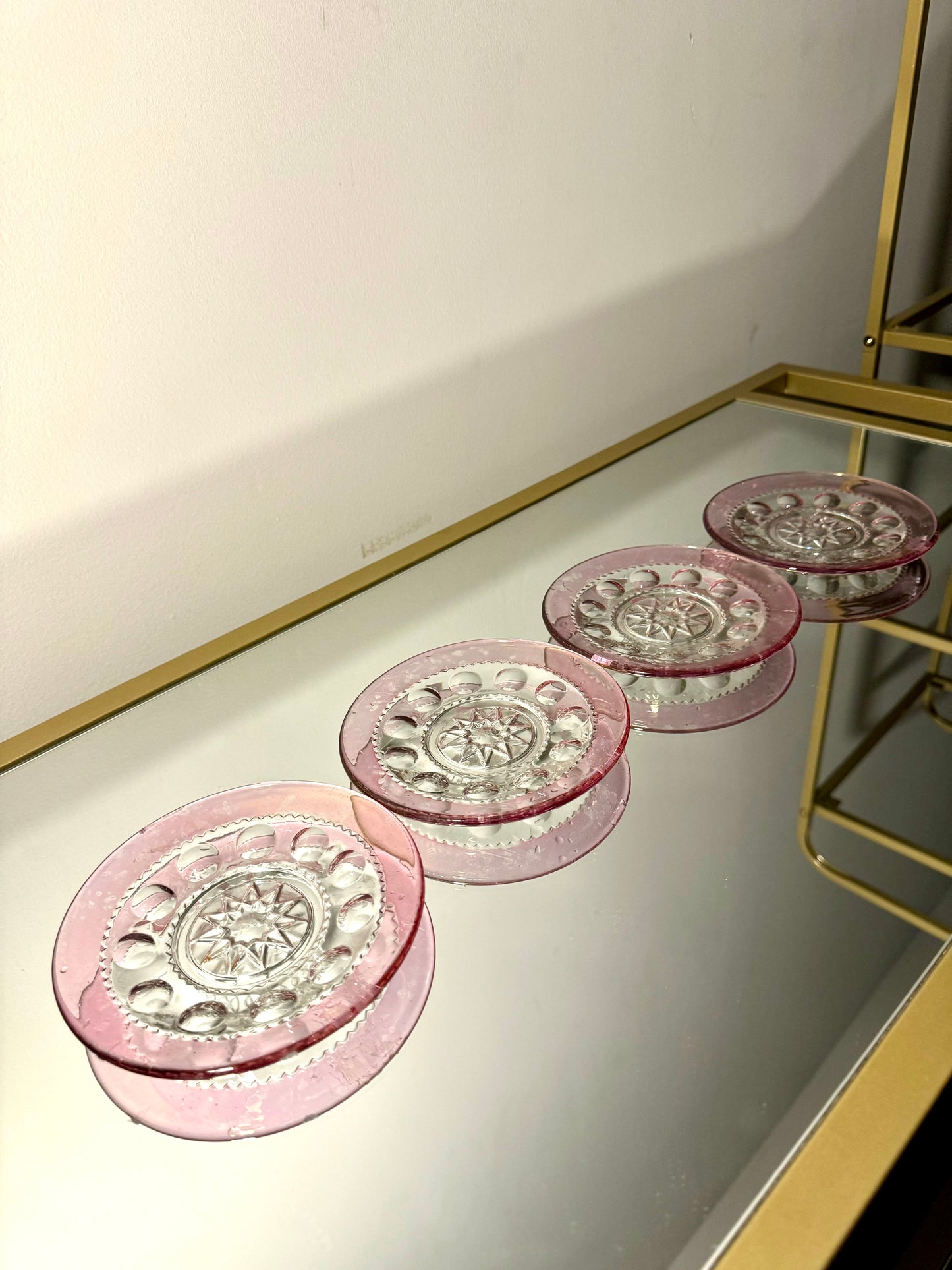 pink/clear glass saucer set
