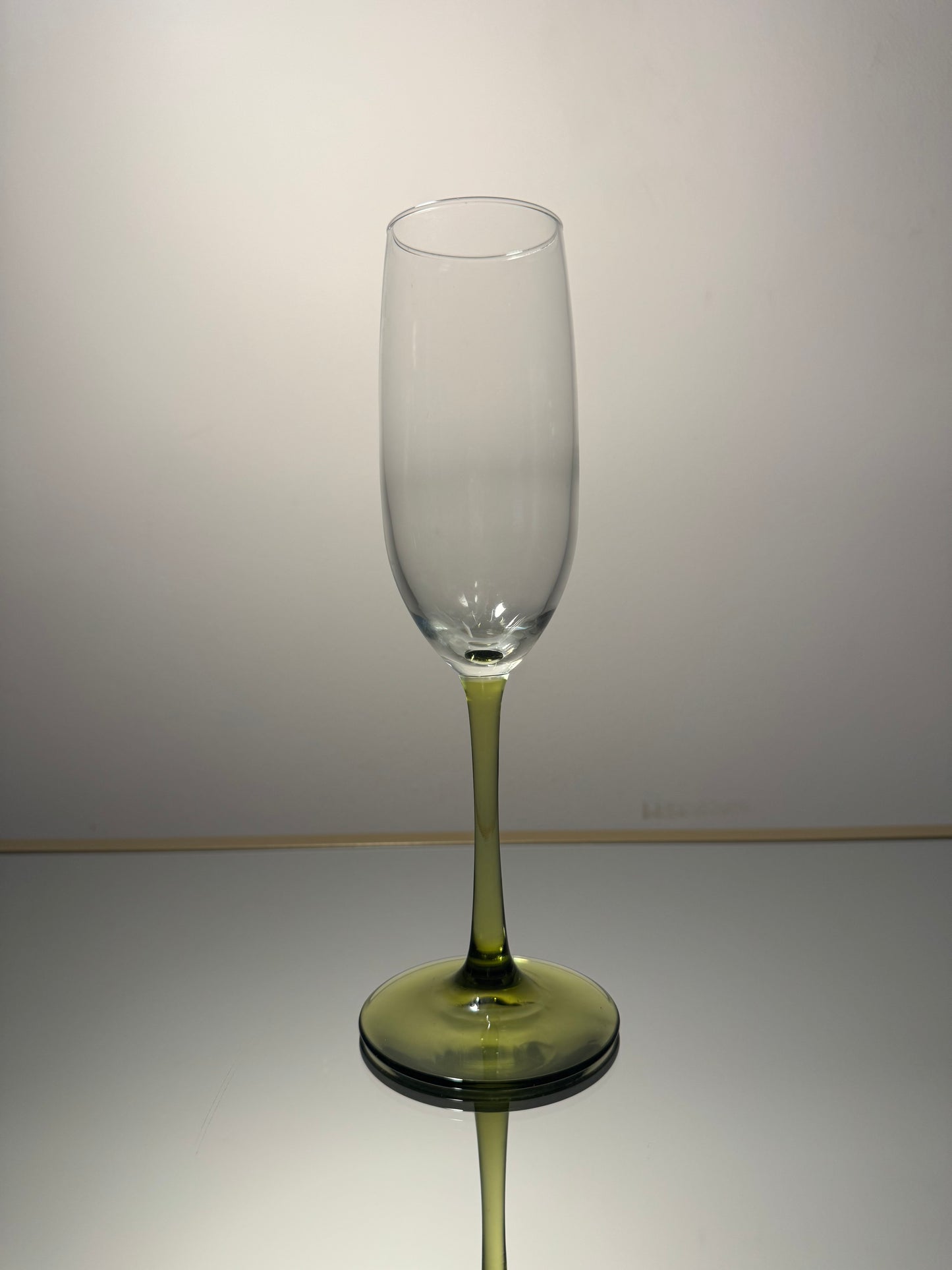 wine glass w/ green stem